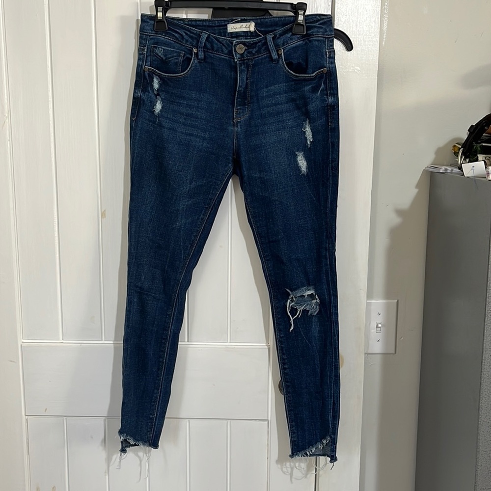 Unpublished dark wash uneven hem skinny jeans. Size 28. 83% cotton.